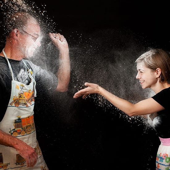 actors playing with flour